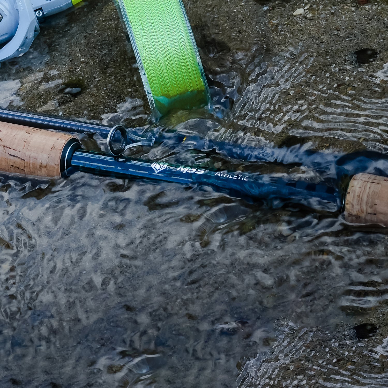 HANDING Magic L fishing rod in water, MSS ATHLETIC logo